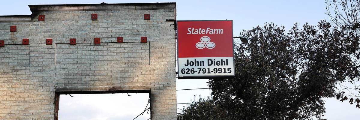 State Farm sign on burned building