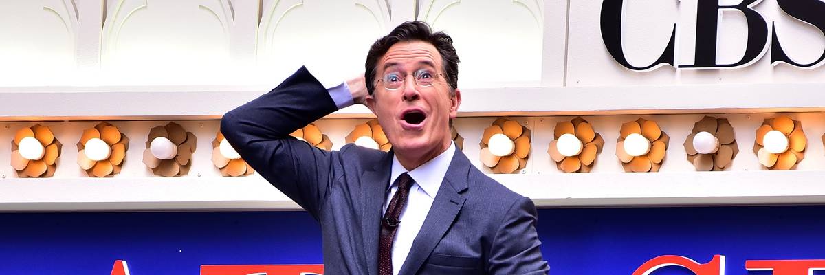 Stephen Colbert in front of "Late Show" marquee.