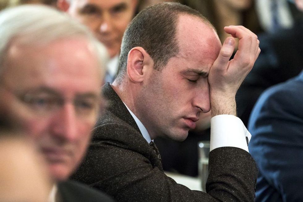 Stephen Miller rubs his eyes