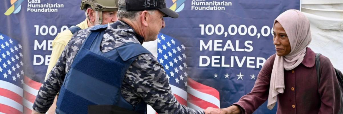 Steve Witkoff shakes hands with a Palestinian woman at an aid center