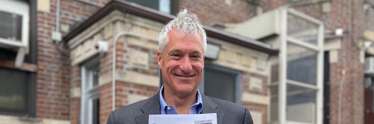 Steven Donziger shows his release papers