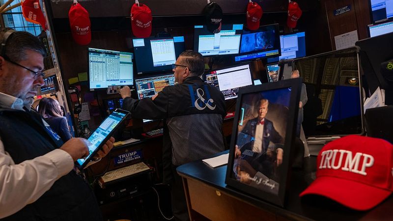 Stock traders surrounded by Trump gear