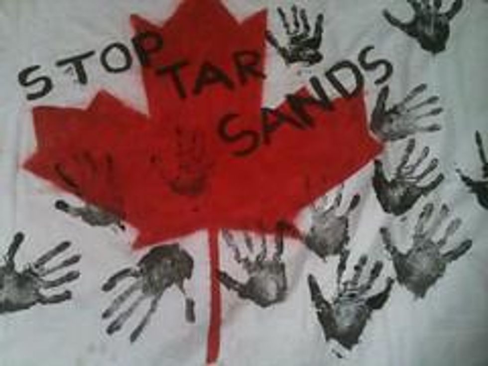 Stop Tar Sands action 18th June 2011 - Flag with handprints 03
