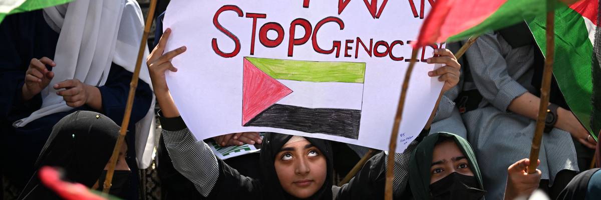 "Stop War / Stop Genocide" sign says