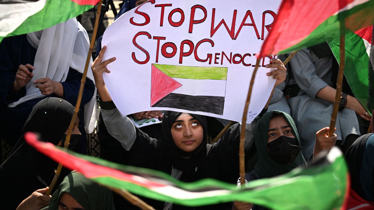 "Stop War / Stop Genocide" sign says