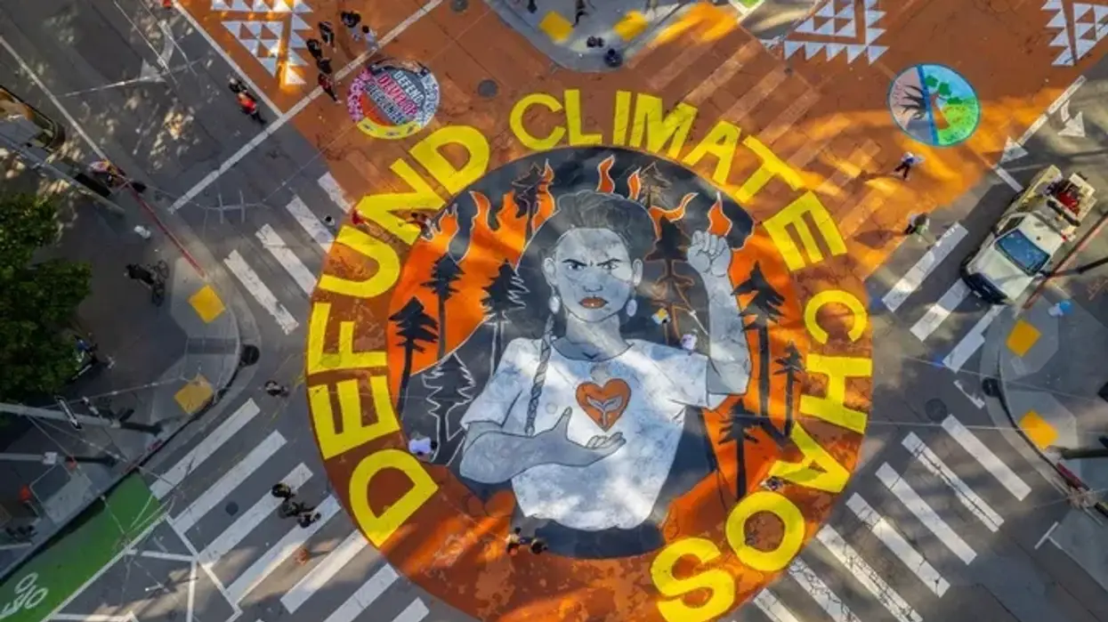 Street art painted in Northern California in 2021 themed around the demand to 'Defund Climate Chaos.'