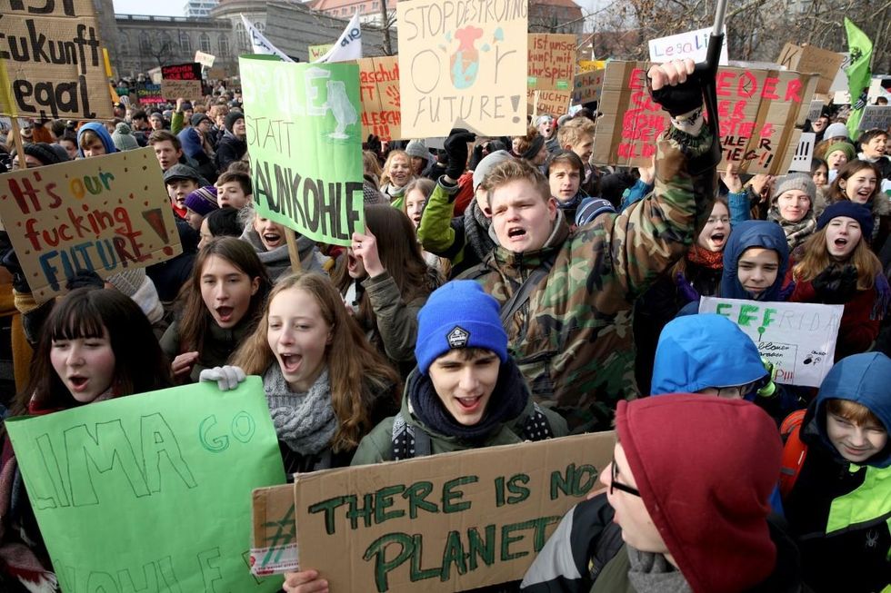 Striking high school students march to protest for more effective government climate change policy on January 25, 2019 in Berlin, Germany. The march, titled 'Friday for Future,' is coinciding with a meeting of the German government Coal Commission, which is due to present its policy recommendation today for charting Germany's reduction of coal-based energy production. Over the last 15 years Germany has made strong strides in renewable energy production, though coal from domestic mines remains its biggest energy source. (Photo: Omer Messinger/Getty Images)