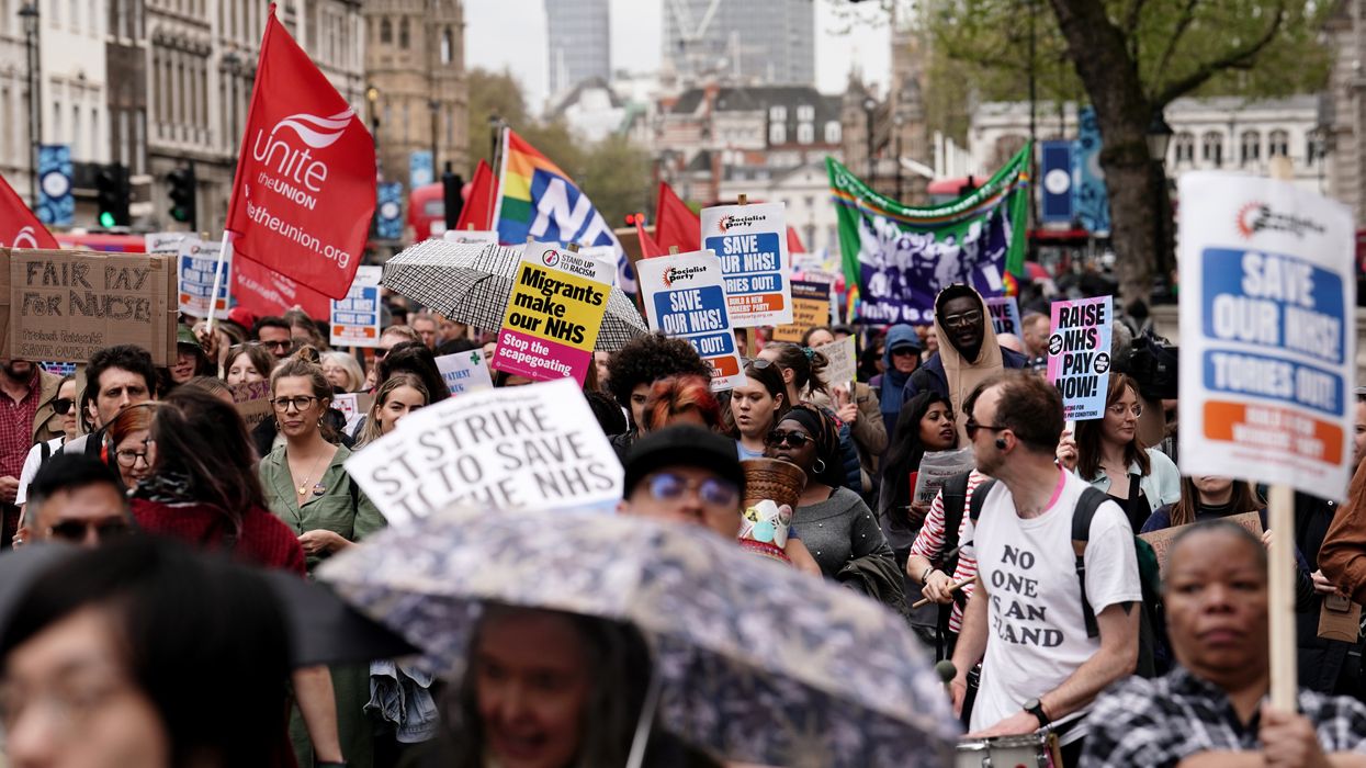 Striking NHS workers march from St Thomas' Hospital to Trafalgar Square in London on May 1, 2023.