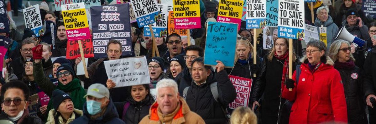 Striking nurses march in London on January 18, 2023.