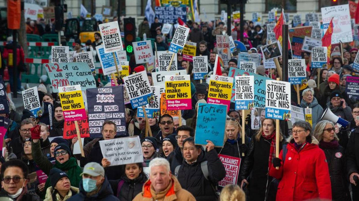 Striking nurses march in London on January 18, 2023.