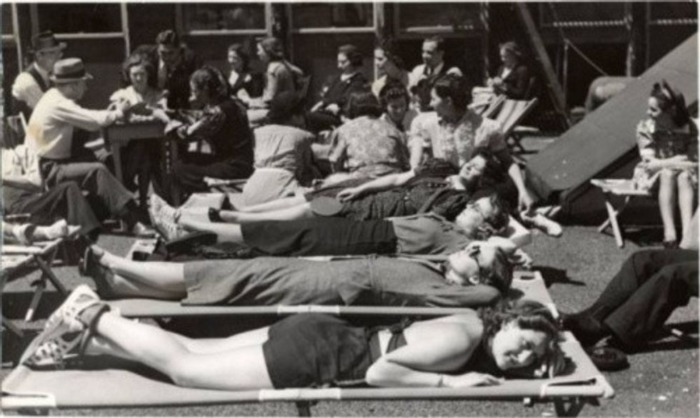 Striking workers from Kress and Newberry stores relax on the roof of their Union headquarters in 1938
