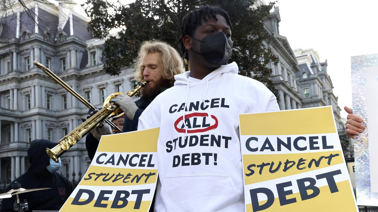 Student loan borrowers and the Too Much Talent Band thank President Joe Biden and Vice President Kamala Harris for extending the student loan pause while demanding that they cancel student debt at a gathering outside the White House on January 13, 2022, in Washington, D.C.