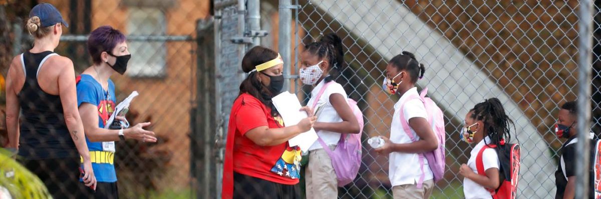 Students arrive at school wearing face masks in Tampa, Florida.