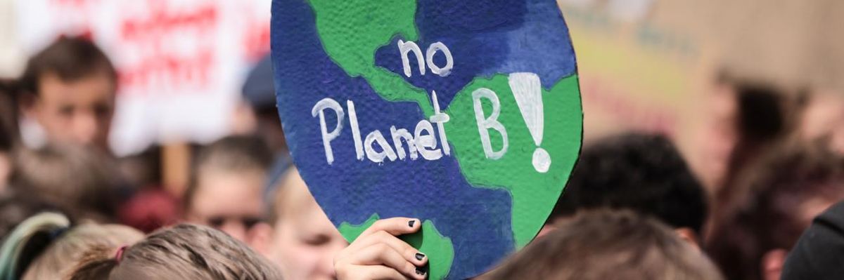Students demonstrate holding signs reading "There is no Planet B" during the Fridays for Future climate strikes in May 2019.