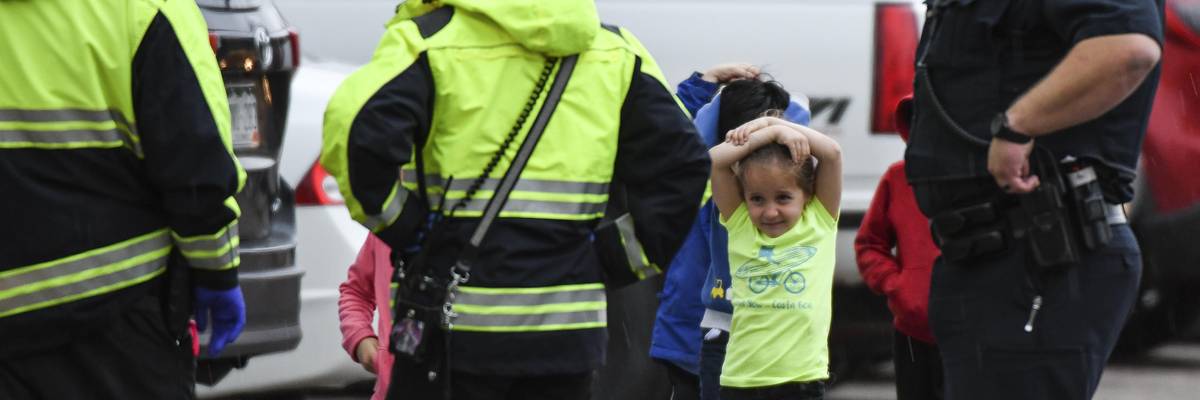 Students get off buses after being evacuated to a recreation center following a school shooting that injured at least seven children on May 7, 2019 in Highlands Ranch, Colorado.
