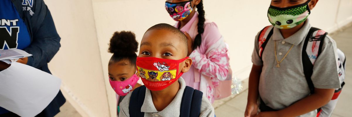 Students make their way to the front door of Normont Elementary School in Harbor City, California on the first day of in-person instruction on August 16, 2021. (Photo: Al Seib/Los Angeles Times via Getty Images)