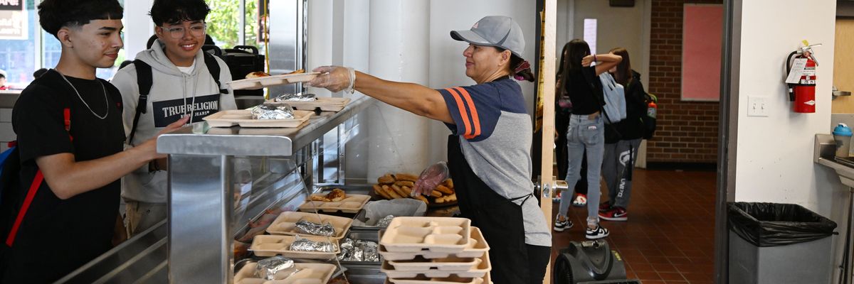 Students pick up their lunch at the school cafeteria
