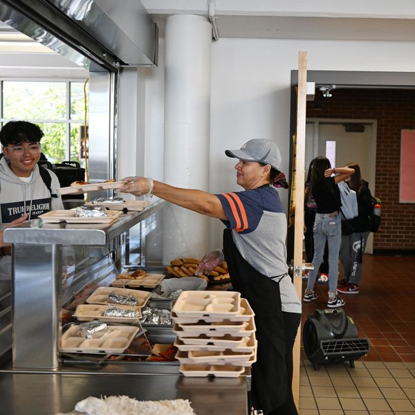 Students pick up their lunch at the school cafeteria