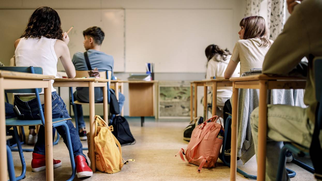 Students sit in a classroom.