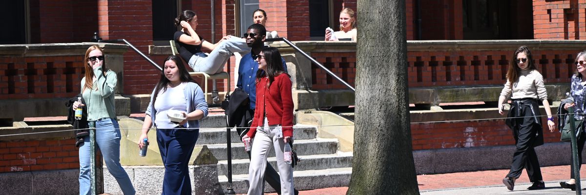 Students walk on campus at Harvard University