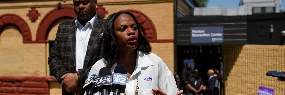 Summer Lee speaks to the press outside of a polling station