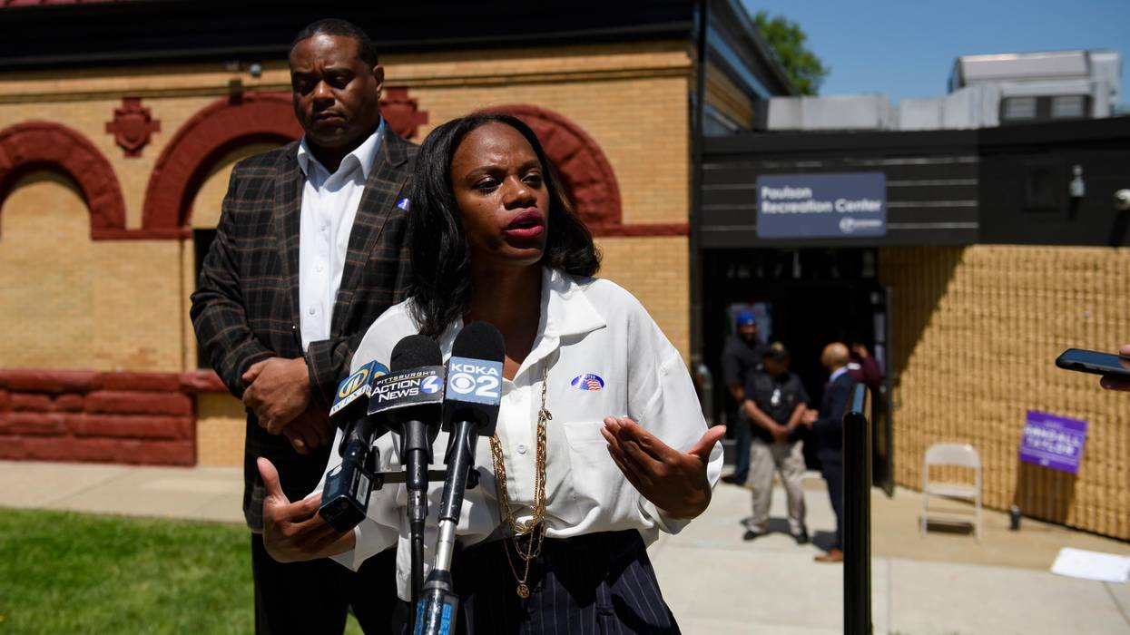 Summer Lee speaks to the press outside of a polling station