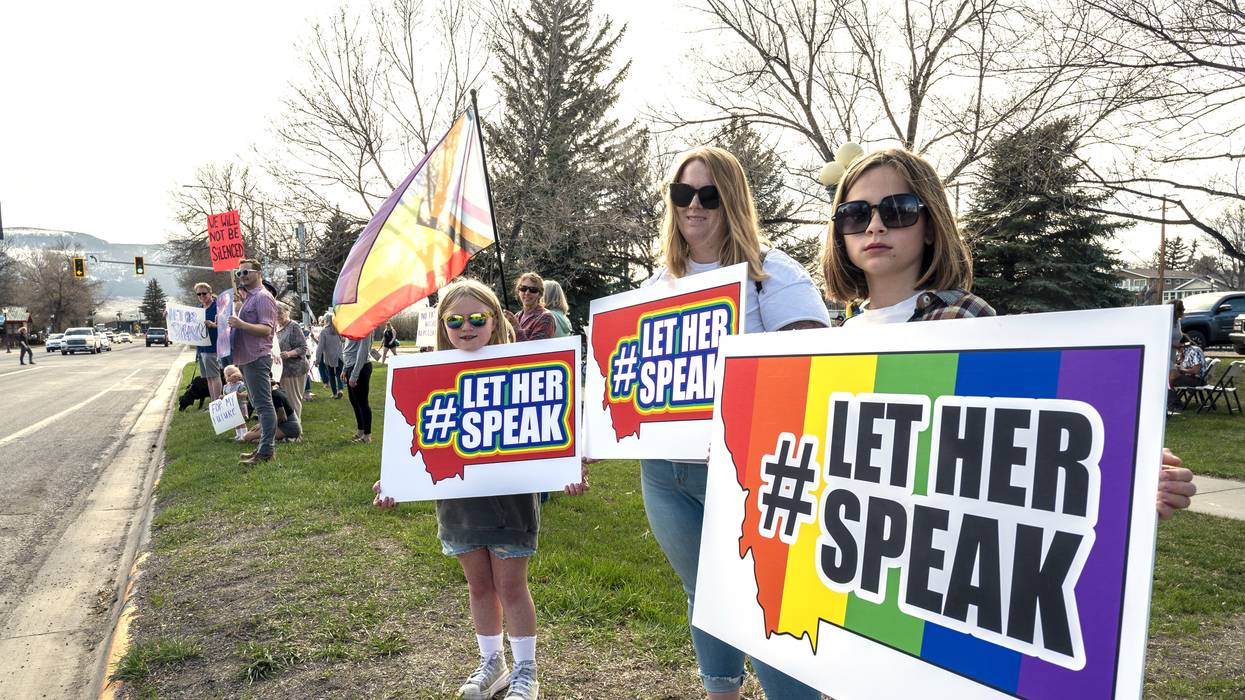 Supporters hold signs near a rally in support of transgender lawmaker Zooey Zephyr