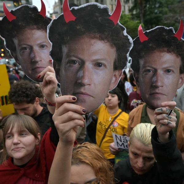 Supporters of Brazilian President Luiz Inácio Lula da Silva hold masks depicting Meta CEO Mark Zuckerberg with red horns