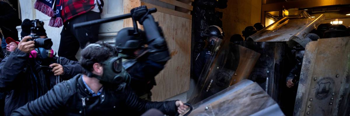 Supporters of Donald Trump attack police with weapons at the US Capitol on January 6, 2021