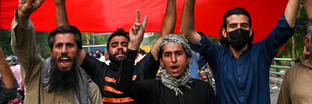 Supporters of former Pakistani Prime Minister Imran Khan celebrate in Lahore after the Supreme Court declared Khan's arrest "invalid" on May 11, 2023.
