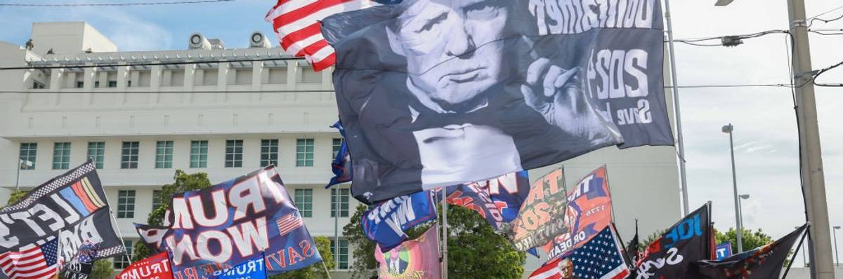 Supporters of former U.S. President Donald Trump stand outside of the Alto Lee Adams Sr. U.S. Courthouse