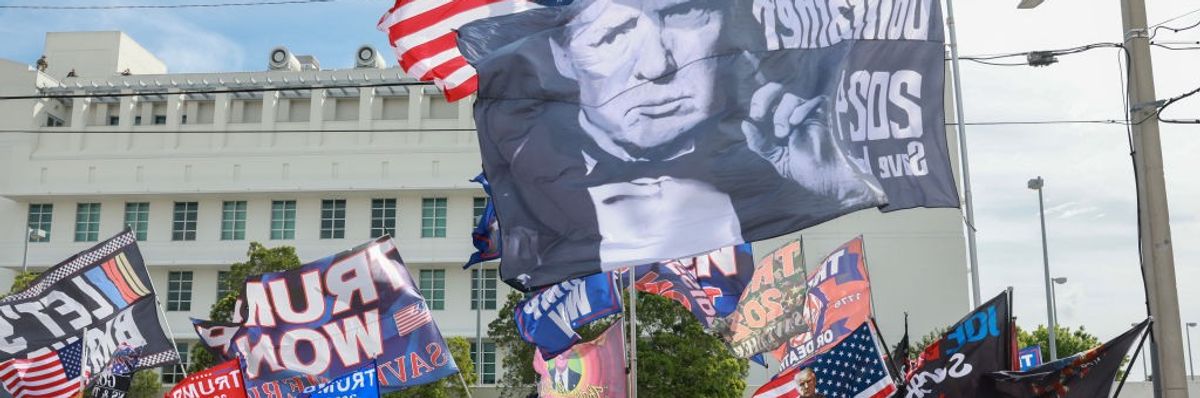 Supporters of former U.S. President Donald Trump stand outside of the Alto Lee Adams Sr. U.S. Courthouse