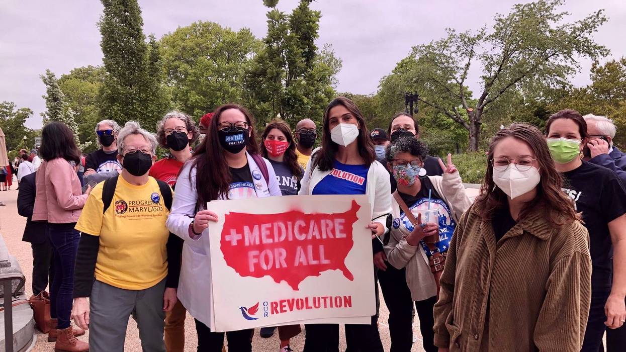 Supporters of Medicare for All pose