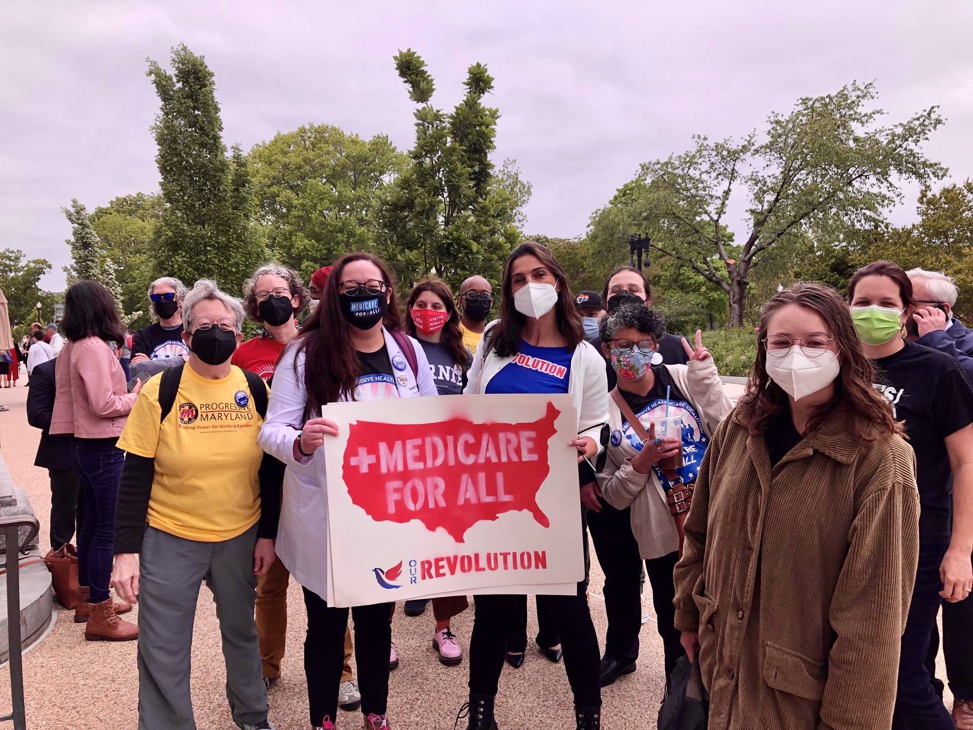 Supporters of Medicare for All pose