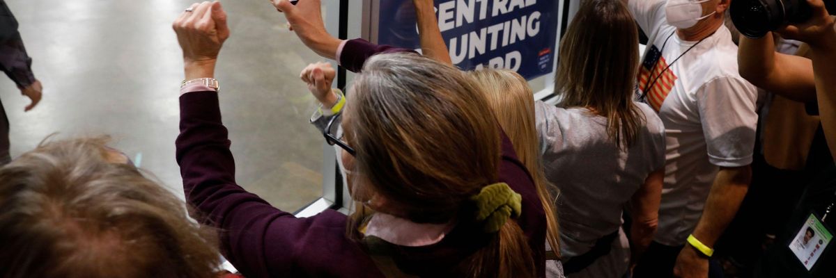 Supporters of then-President Donald Trump bang on the glass and chant slogans outside the room where absentee ballots for the 2020 general election are being counted at TCF Center on November 4, 2020 in Detroit, Michigan. (Photo: Jeff Kowalsky/AFP via Getty Images)