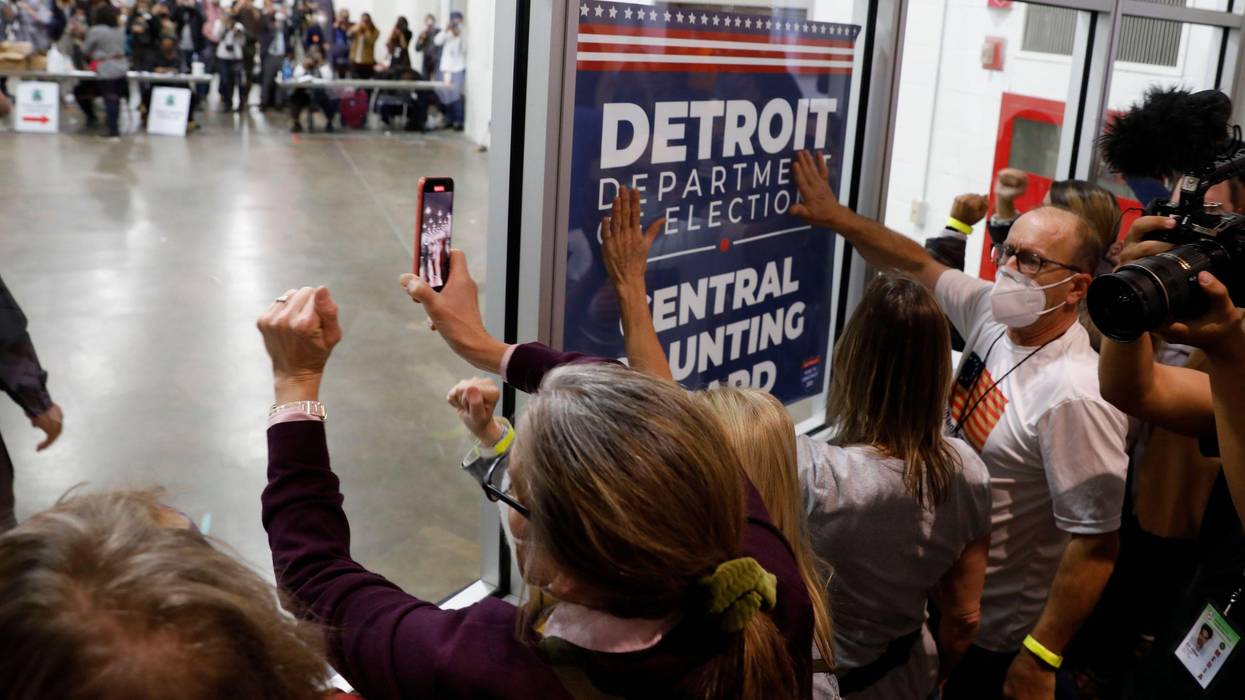 Supporters of then-President Donald Trump bang on the glass and chant slogans outside the room where absentee ballots for the 2020 general election are being counted at TCF Center on November 4, 2020 in Detroit, Michigan. (Photo: Jeff Kowalsky/AFP via Getty Images)