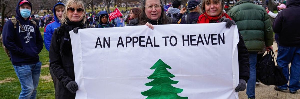 Supporters of then-U.S. President Donald Trump hold an "Appeal to Heaven" flag