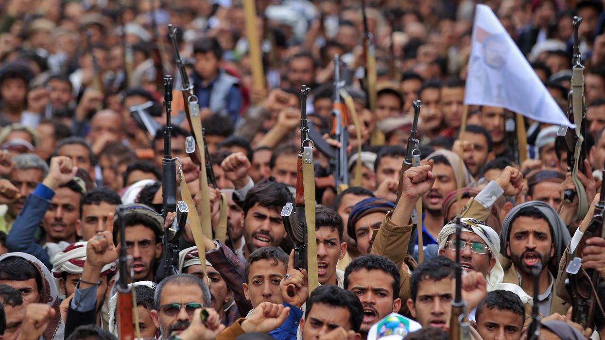 Supporters of Yemen's Houthi rebels take part in a rally marking the eighth anniversary of the Saudi-led intervention in their country, in Sanaa on March 26, 2023.