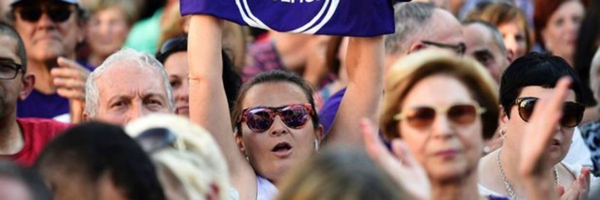 Supporters rally for the anti-austerity Podemos Party