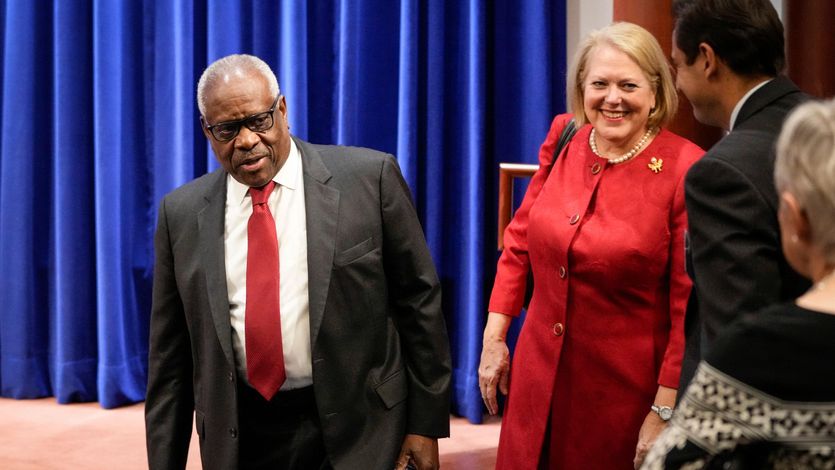 Supreme Court Justice Clarence Thomas arrives at an event with his wife Ginni Thomas