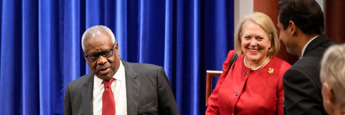 Supreme Court Justice Clarence Thomas arrives at an event with his wife Ginni Thomas