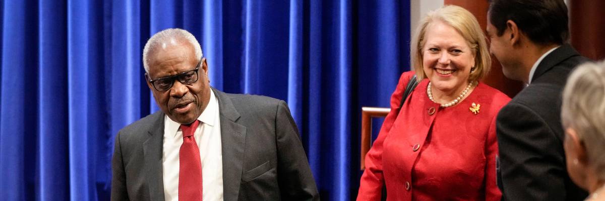 Supreme Court Justice Clarence Thomas arrives at an event with his wife Ginni Thomas