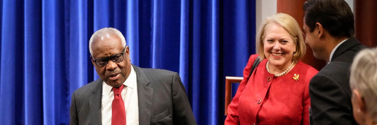 Supreme Court Justice Clarence Thomas arrives at an event with his wife Ginni Thomas