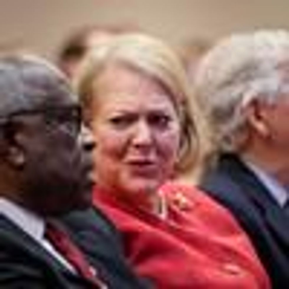 Supreme Court Justice Clarence Thomas sits with his wife Virginia Thomas