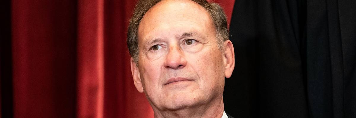 Supreme Court Justice Samuel Alito sits during a group photo