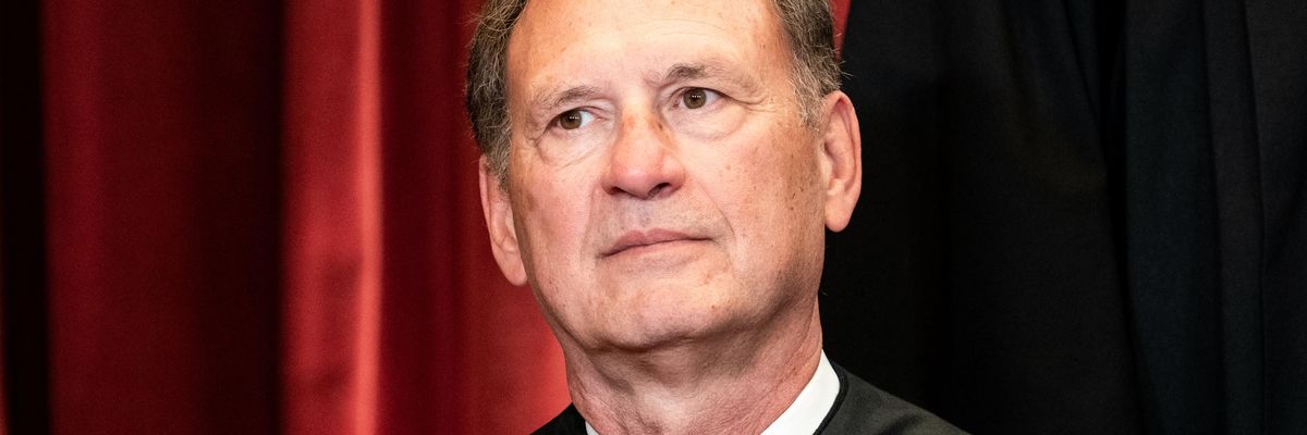 Supreme Court Justice Samuel Alito sits during a group photo