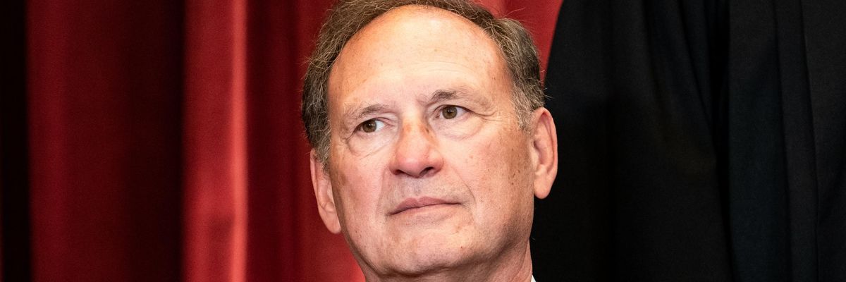 Supreme Court Justice Samuel Alito sits during a group photo