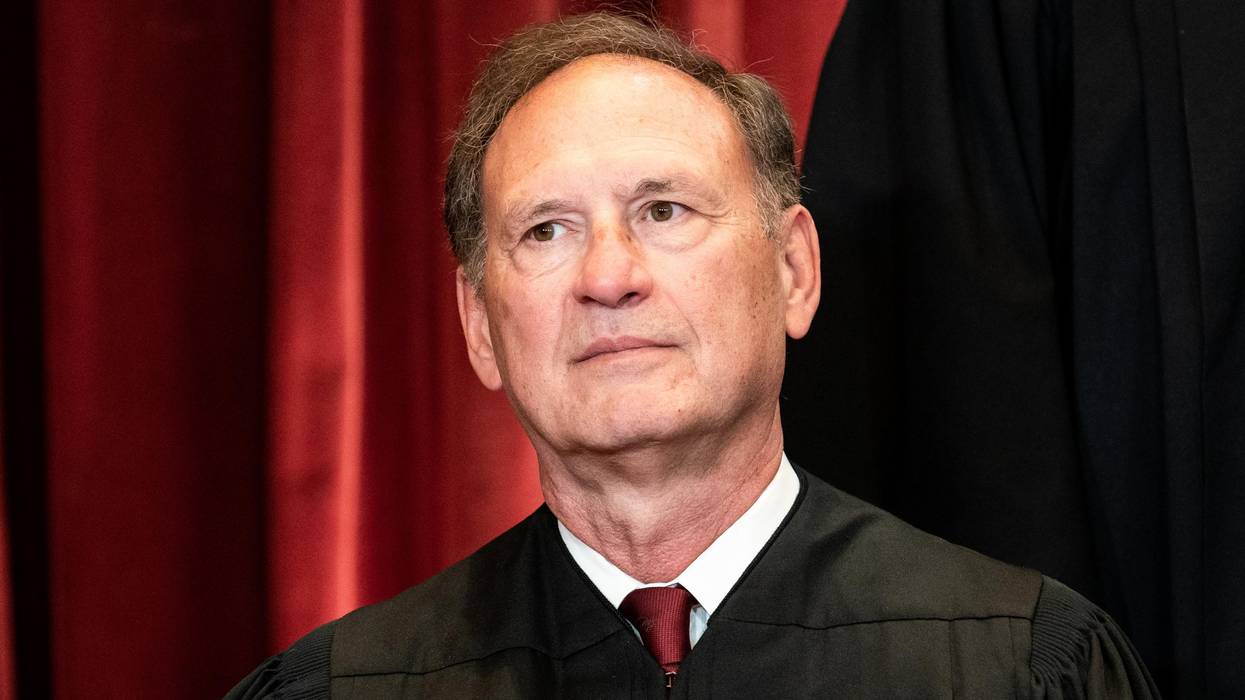 Supreme Court Justice Samuel Alito sits during a group photo