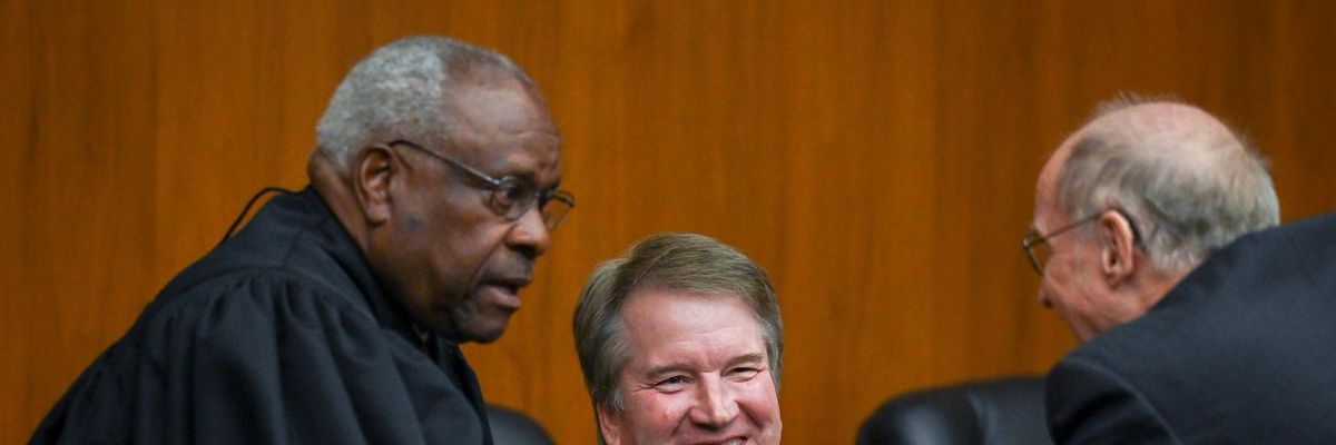 Supreme Court Justices Clarence Thomas and Brett Kavanaugh appear at a ceremony