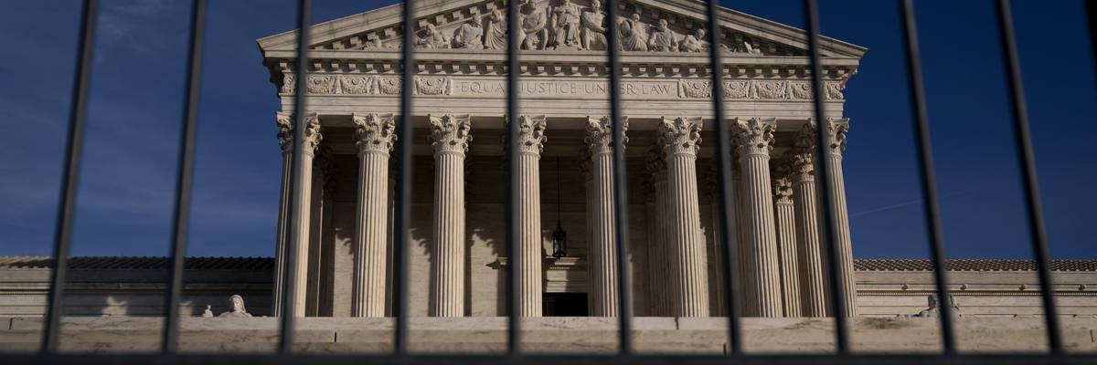 Supreme Court seen through barricades.